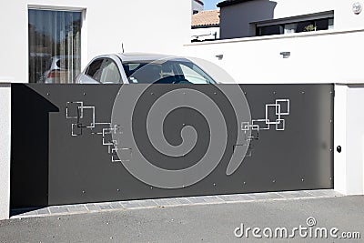 modern sliding dark gray gate aluminum portal design high grey door outdoor Stock Photo