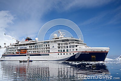 Expedition Ship, Cruiser, Cruise Liner in Antarctica with Zodiacs in front. Hanseatic Nature from Hapag Lloyd Cruises. Editorial Stock Photo