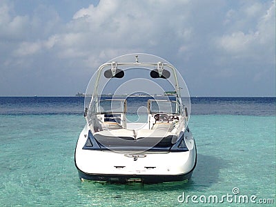 Modern speed boat in the lagoon of tropical island in the Indian Ocean, Maldives Stock Photo