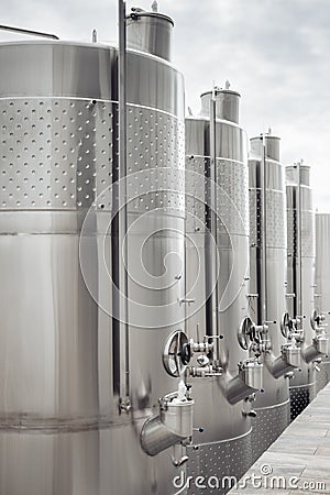 Modern stainless steel barrels for wine fermentation at a winery. Wine industry. Stock Photo