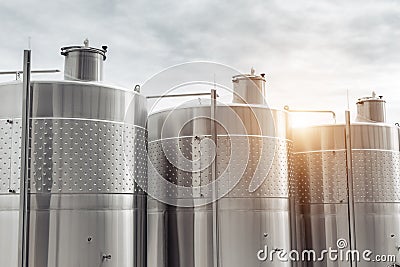 Modern stainless steel barrels for wine fermentation at a winery. Wine industry. Stock Photo