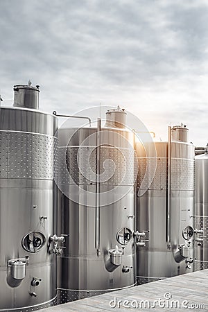 Modern stainless steel barrels for wine fermentation at a winery. Wine industry. Stock Photo