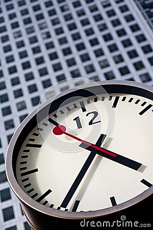 Modern stainless steel clock at canary wharf Stock Photo