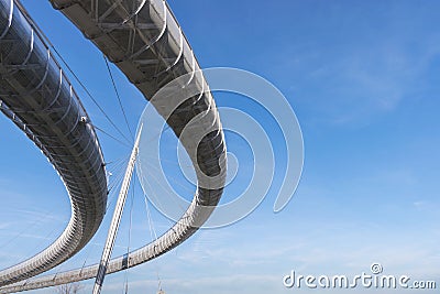 Modern steel bridge on a blue background of the sky Editorial Stock Photo