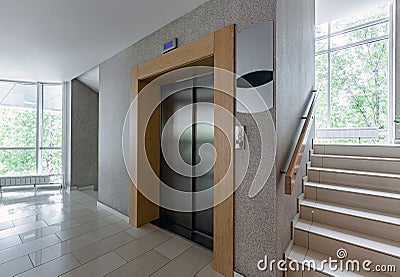 Modern steel elevator. Stairs, interior, office. perspective wide angle. Stock Photo