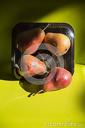Modern still life with healthy food and plastic pack. Stock Photo