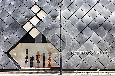 modern store facade with window display and lettering of the brand Bottega Veneta in Tokyo, Japan Editorial Stock Photo