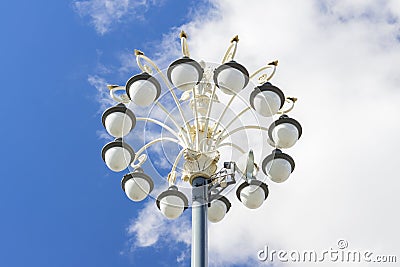 Modern street light with multiple bulbs against blue sky Stock Photo