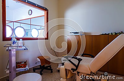 Modern Studio Spa for Wellness with chairs, creams, dark wood decoration, interior salon for skin and body care Stock Photo