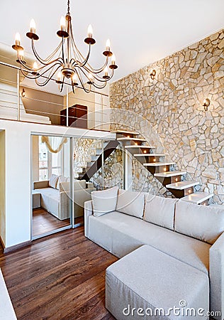 Modern style two-high living-room interior with staircase Stock Photo