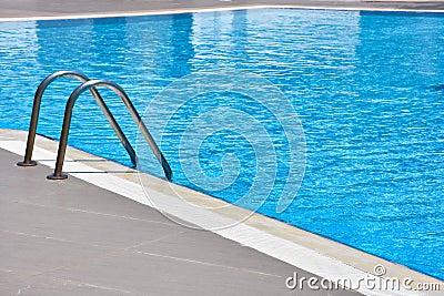 Modern swimming pool with stairs at resort Stock Photo