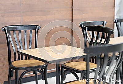 Modern tables and chairs in coffee shop or bekery store Stock Photo