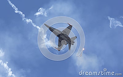 Modern tactical jet fighter shooting flares Stock Photo