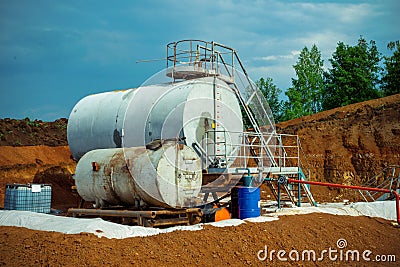 Modern tank and pipeline chemistry factory with large shine tanks for the mixer product engine oil Stock Photo