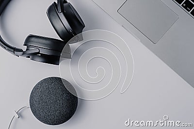 modern technologies headphones laptop and smart speaker over white background Stock Photo