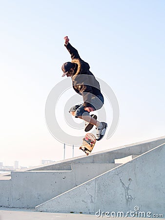 Modern teenage skater catching some air Stock Photo