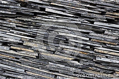Modern thin slate stone layered wall texture pattern background. Stock Photo