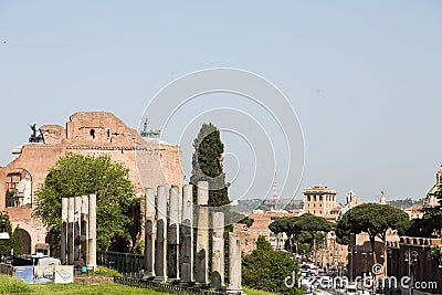 Modern Traffic by Anceint Ruins in Rome Stock Photo
