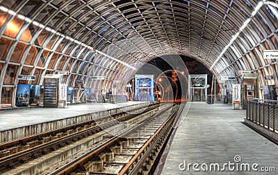 Modern tram station on Basarab Overpass Bridge during night Editorial Stock Photo