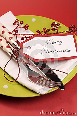 Modern trend lime green and red Merry Christmas table place setting. Vertical Stock Photo