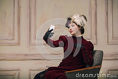 Modern trendy look of Portrait of an Unknown Woman. Retro style, comparison of eras concept. Stock Photo