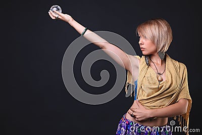 Modern Tribal Woman holding crystals Stock Photo