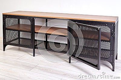 Modern TV stand with metal frame and wooden shelves Stock Photo