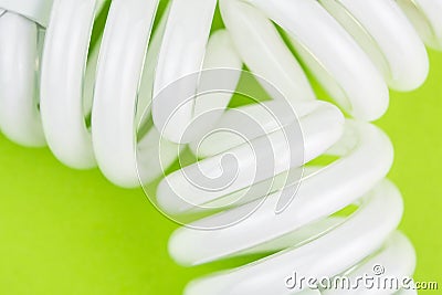 Modern twisted lightbulbs on lime green backgound Stock Photo