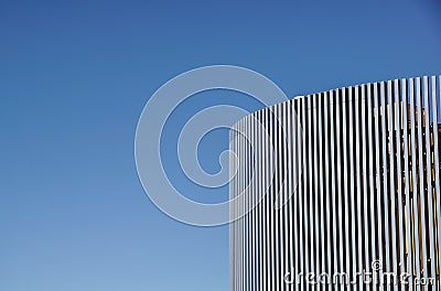 Modern urban architecture detail with aluminum or steel beams and panels . blue sky background Stock Photo