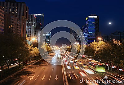 Modern urban city at dusk with traffic Stock Photo