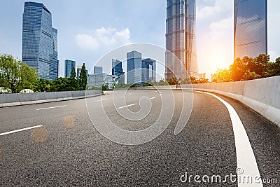 The modern urban commercial building and asphalt road Stock Photo