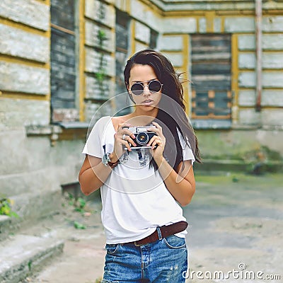 Modern urban girl with vintage photo camera outdoor Stock Photo