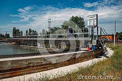 Modern urban sewage treatment plant. Dirty waste water flowing in sedimentation tank Stock Photo