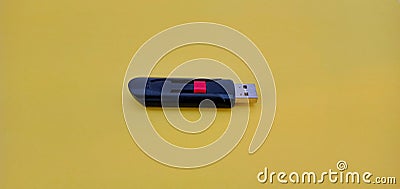Modern USB Flash drive on yellow background Stock Photo