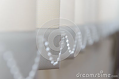 Modern vertical fabric blinds on the window Stock Photo