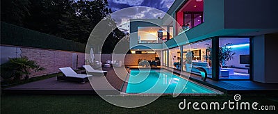 Modern villa with colored led lights at night Stock Photo