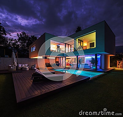 Modern villa with colored led lights at night Stock Photo