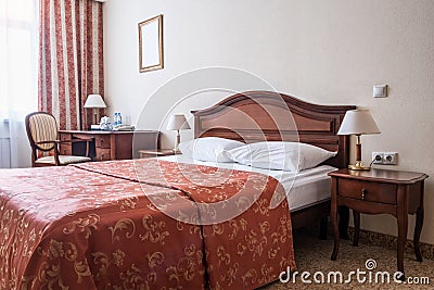 Modern, warm, inviting bedroom or hotel room Stock Photo