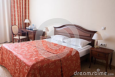 Modern, warm, inviting bedroom or hotel room Stock Photo