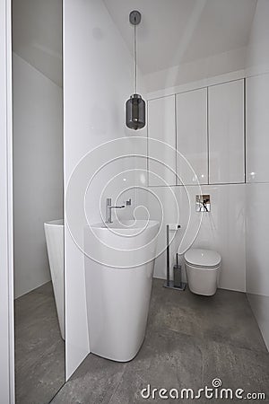 Modern water closet with miror and white walls Editorial Stock Photo