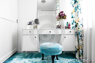 white, feminine dressing room with minimalist vanity table and mirror Stock Photo