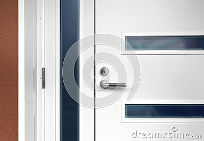 Modern white front door with handle Stock Photo