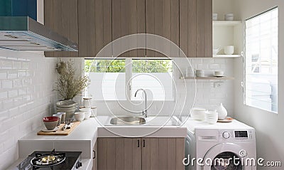 Modern white kitchen with counter and white details, minimalist interior Stock Photo