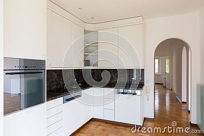 Modern white kitchen in a renovated villa Stock Photo