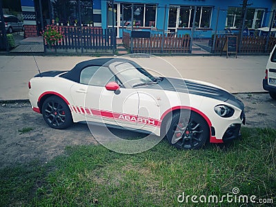 White sport car Fiat 124 Spider Abarth coupe parked Editorial Stock Photo