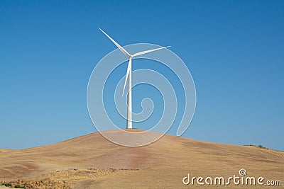 Modern wind mill and yellow fields in Andalusie, Spain Stock Photo