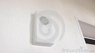 Modern wireless electronic door bell for two-tone tone, close-up. White wall bell. Stock Photo