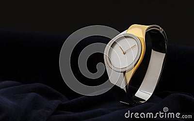 Modern woman gold and silver Wristwatch on dark velvet fabric background Stock Photo