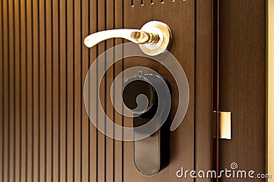 Modern wooden looking steel door, security electronic lock system Stock Photo