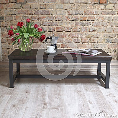 Modern wooden table in the loft interior Stock Photo